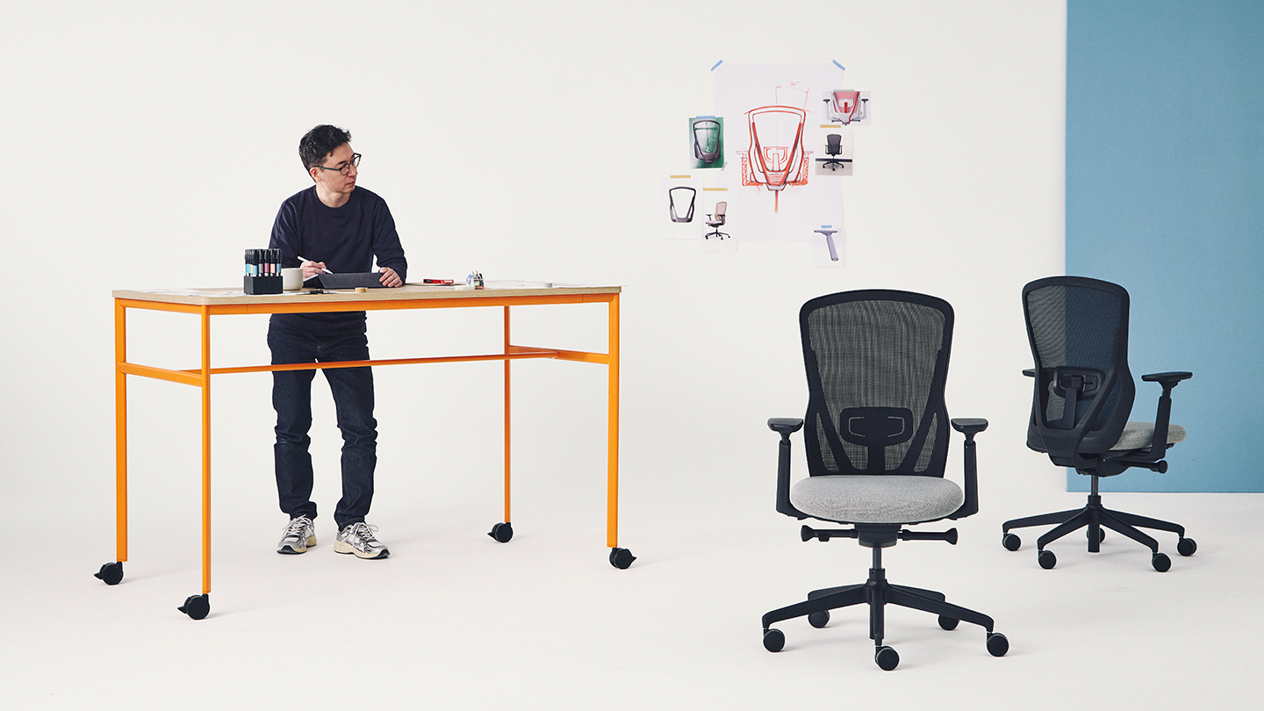 designer looks at the chairs he is creating